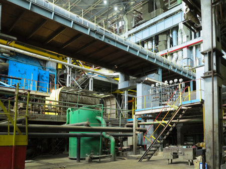 Industrial big water pumps with electric motors, pipes, tubes, equipment and steam turbine at modern power plantの写真素材