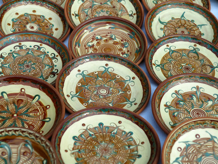 Beautiful handmade clay pots and other dishes sold at the fair shopの写真素材