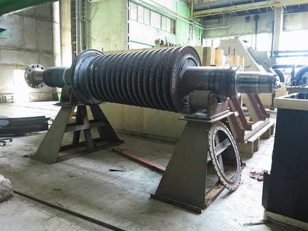 Power generator steam turbine in repair process, machinery, pipes, tubes, at an power plantの写真素材