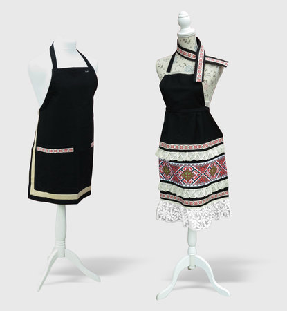Beautiful decorated kitchen apron on support over white background with shadowの写真素材