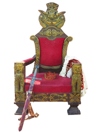 Old red golden king throne with sword and crown isolated over white background.の写真素材