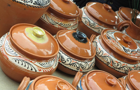 Beautiful handmade clay pots and other dishes sold at the fair shopの写真素材