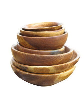 stack of wooden plates dishware isolated over white backgroundの写真素材