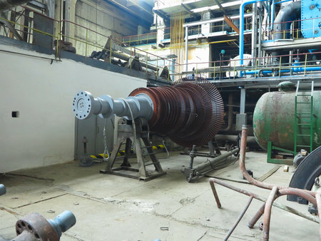 Power generator steam turbine in repair process, machinery, pipes, tubes, at an power plantの写真素材