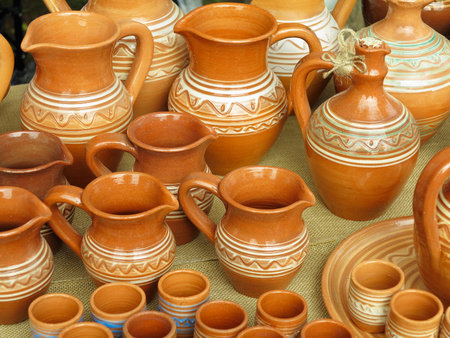 Beautiful handmade clay pots and other dishes sold at the fair shopの写真素材