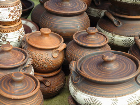Beautiful handmade clay pots and other dishes sold at the fair shopの写真素材