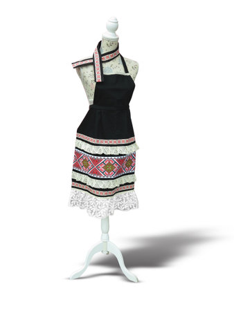 Beautiful decorated kitchen apron on support over white background with shadowの写真素材