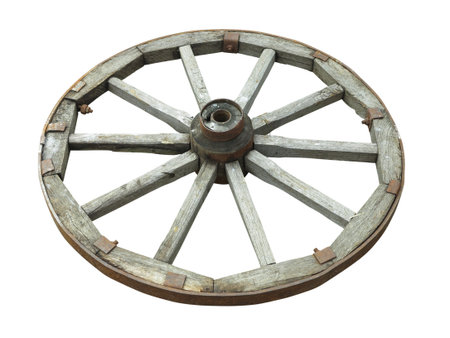 Old brown wooden wagon wheel from a cart isolated over white backgroundの写真素材