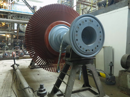 Power generator steam turbine in repair process, machinery, pipes, tubes, at an power plantの写真素材