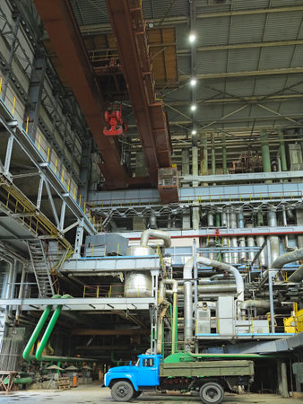 Industrial big water pumps with electric motors, pipes, tubes, equipment and steam turbine at modern power plantの写真素材