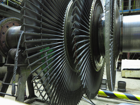 Power generator steam turbine in repair process, machinery, pipes, tubes, at an power plantの写真素材