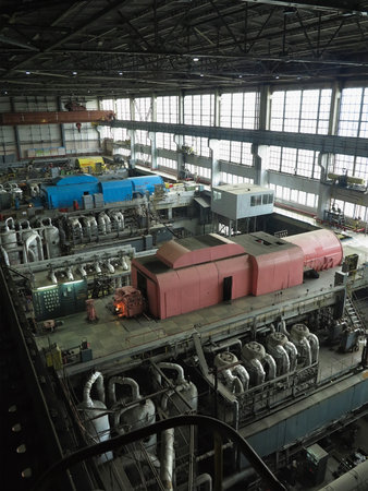 28.01.2020, Moldova, Chisinau: Power generator steam turbine in repair process, machinery, pipes, tubes, at an power plantのeditorial素材