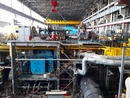 11.02.2020, Moldova, Chisinau: Power generator steam turbine in repair process, machinery, pipes, tubes, at an power plantのeditorial素材