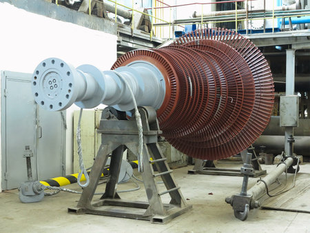 Power generator steam turbine in repair process, machinery, pipes, tubes, at an power plantの写真素材