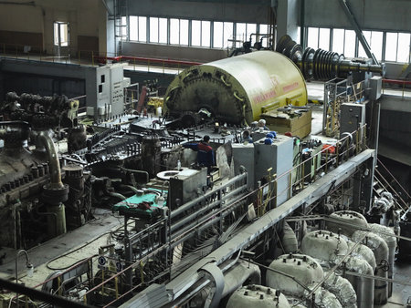 28.01.2020, Moldova, Chisinau: Power generator steam turbine in repair process, machinery, pipes,...