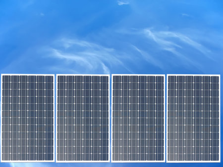 Power solar panel on blue sky background, alternative clean green energy conceptの写真素材