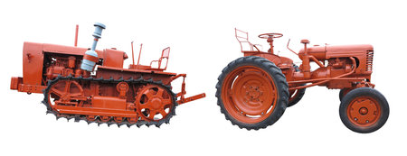 Old red agricultural tractors isolated over white backgroundの写真素材