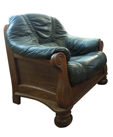Old wooden classic leather green armchair isolated over white backgroundの写真素材
