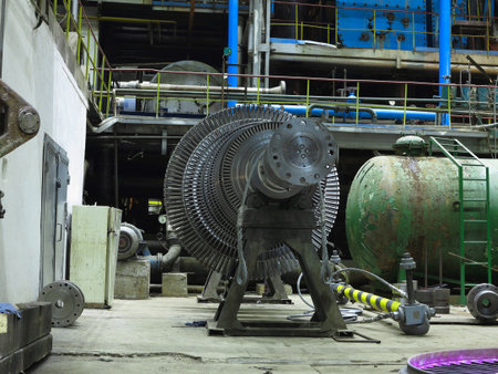 Power generator steam turbine in repair process, machinery, pipes, tubes, at an power plantの写真素材