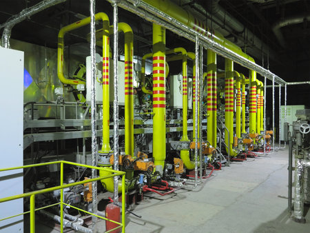 Gas yellow tubes at an industrial thermal electric power plant, night sceneの写真素材