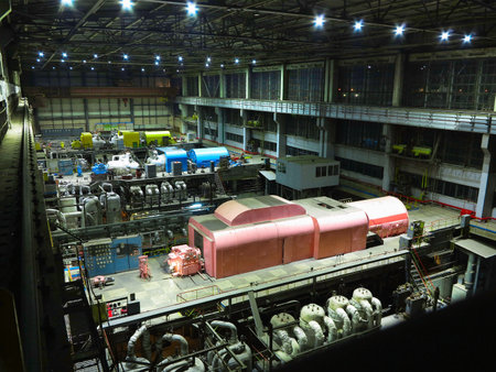 Pipes, steel tubes, steam turbine and equipment at industrial power plant, night sceneのeditorial素材