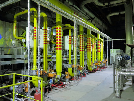Gas yellow tubes at an industrial thermal electric power plant, night sceneの写真素材