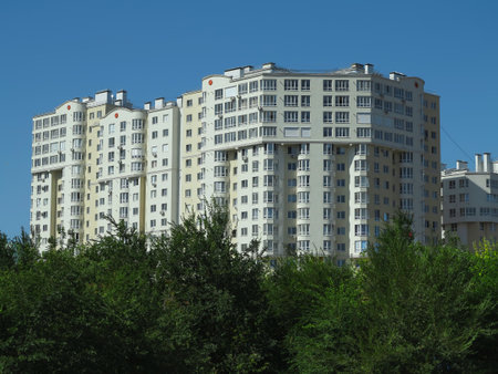 Just build new apartment houses in green forest and blue skyの写真素材