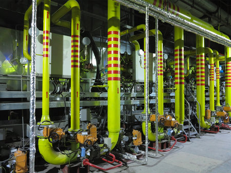 Gas yellow tubes at an industrial thermal electric power plant, night sceneの写真素材