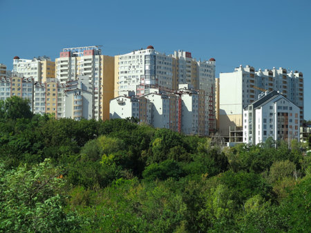 Just build new apartment houses in green forest and blue skyの写真素材
