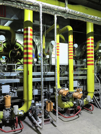 Gas yellow tubes at an industrial thermal electric power plant, night sceneの写真素材