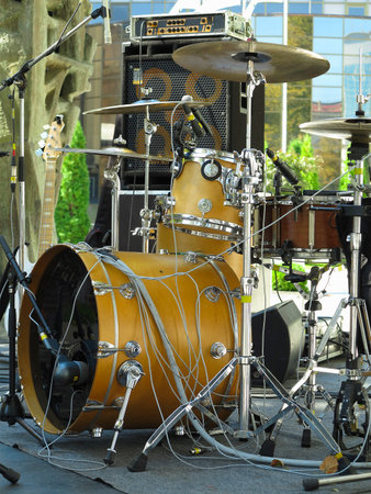 Concert stage: musical instruments, drums, amplifiers, speakers, microphones, cables.の写真素材