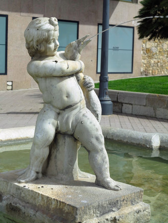 TARRAGONA, SPAIN - 06.07.2022: Fountain "Boy with the Goose" by Greek sculptor of Chalcedon at end of Rambla Nova Boulevard along embankment on sunny summer day in Tarragona, Catalunya, Spainのeditorial素材