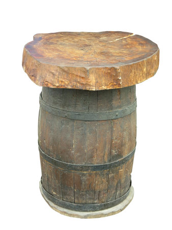 Stylish table made from an old wooden barrel isolated on white backgroundの写真素材