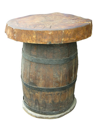 Stylish table made from an old wooden barrel isolated on white backgroundの写真素材