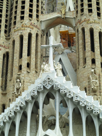 Barcelona, Spain - 05.07.2023: Detail of the facade of sacred family "La Sagrada Familia" , cathedral designed by Gaudi, being built since 19 March 1882 with people donationsのeditorial素材