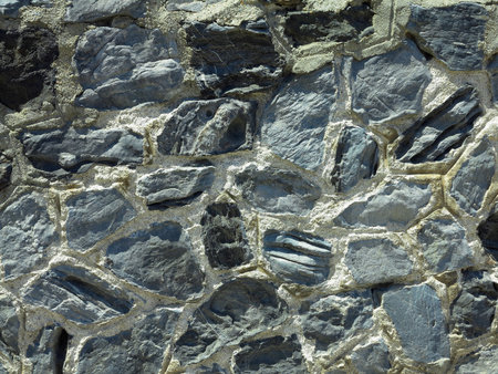 Close up shot of a beautifully textured dry natural stone wallの写真素材