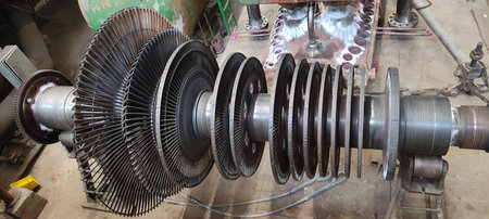 Disassembled steam turbine in the process of repairing and electric generator at a power plantの写真素材