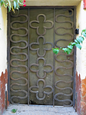 An ancient weathered stylish old wooden brown doorの写真素材