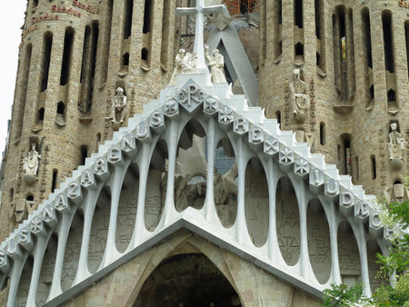 Barcelona, Spain - 05.07.2023: Detail of the facade of sacred family "La Sagrada Familia" , cathedral designed by Gaudi, being built since 19 March 1882 with people donationsのeditorial素材