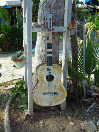 Art installation from an very old brown guitarの写真素材