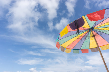 colorful beach umbrella in sky backgroundの写真素材