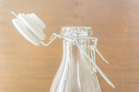 glass bottle on wood background
