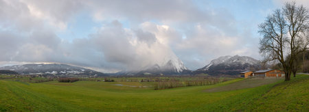 Panoramic view of snow covered Grimming mountain in Ennstal, Steiermark, Austriaの写真素材