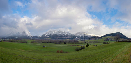 Panoramic view of snow covered Grimming mountain in Ennstal, Steiermark, Austriaの写真素材