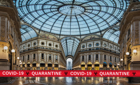 Warning tapes in Galleria Vittorio Emanuele II, famous tourist destination now empty because of coronavirus COVID-19 epidemic danger, in Milan, Lombardy, Italy. Blurred backgroundの写真素材