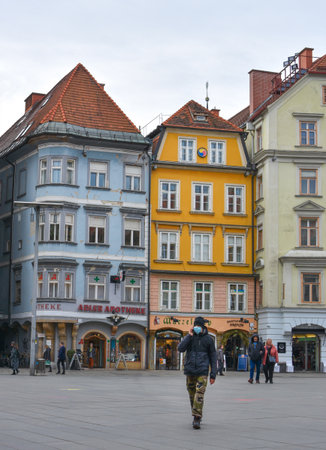 Graz/Austria - Man on city street wearing a face mask for protection against viruses during coronavirus COVID-19 and flu outbreakのeditorial素材