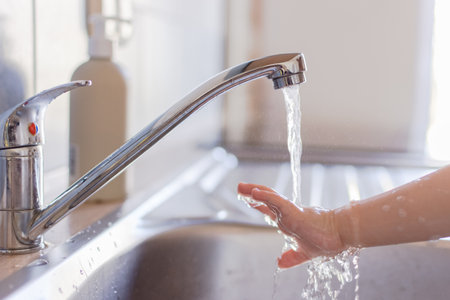 Close up hands of a small children washing hands with soap and water. Clean and hygiene concept.の写真素材