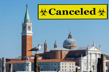 Seagull and San Giorgio di Maggiore church in the background, in Venice, Italy.Travel vacations canceled because of pandemic of coronavirus Covid-19, conceptual photo.の写真素材