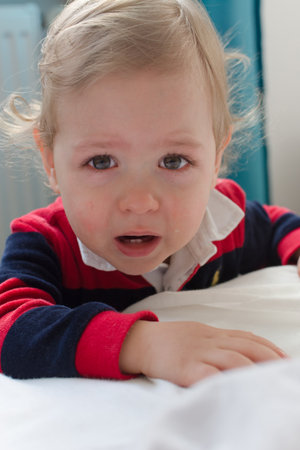 Portrait of a cute little boy cryingの写真素材