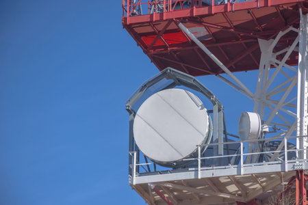 Detail of a telecommunication tower with directional mobile phone and internet antennas. Wireless communication equipment transmitter. 5G Technology.の写真素材